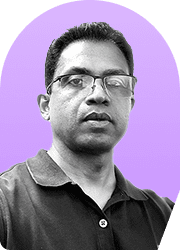 Headshot of a man wearing glasses against a purple background.