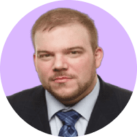 Headshot of a man in a suit and tie.